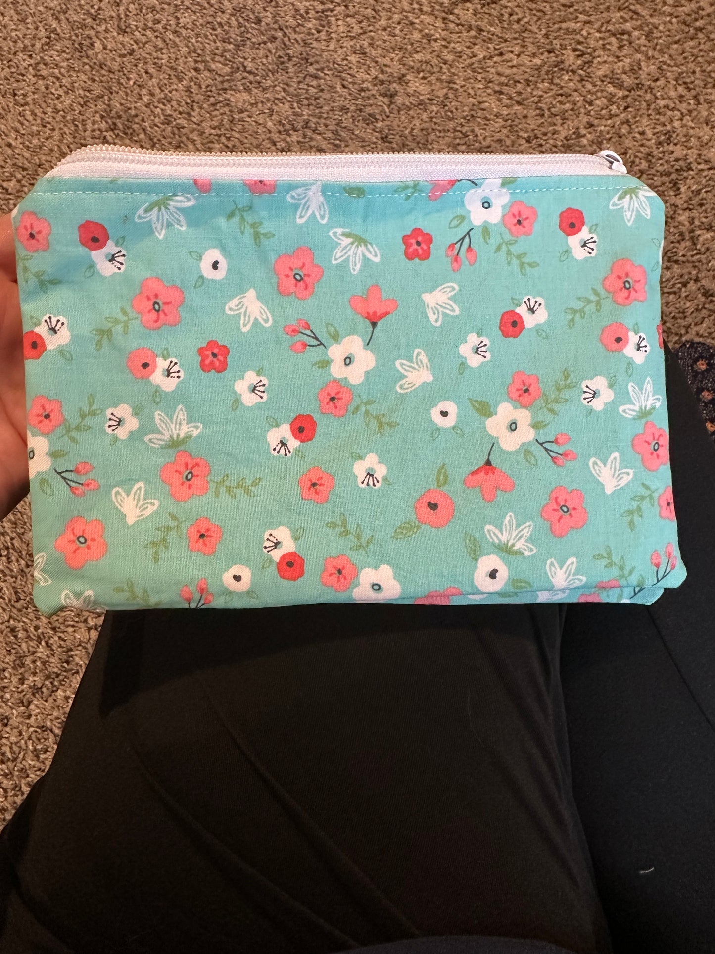Pinched zipper flap pouch