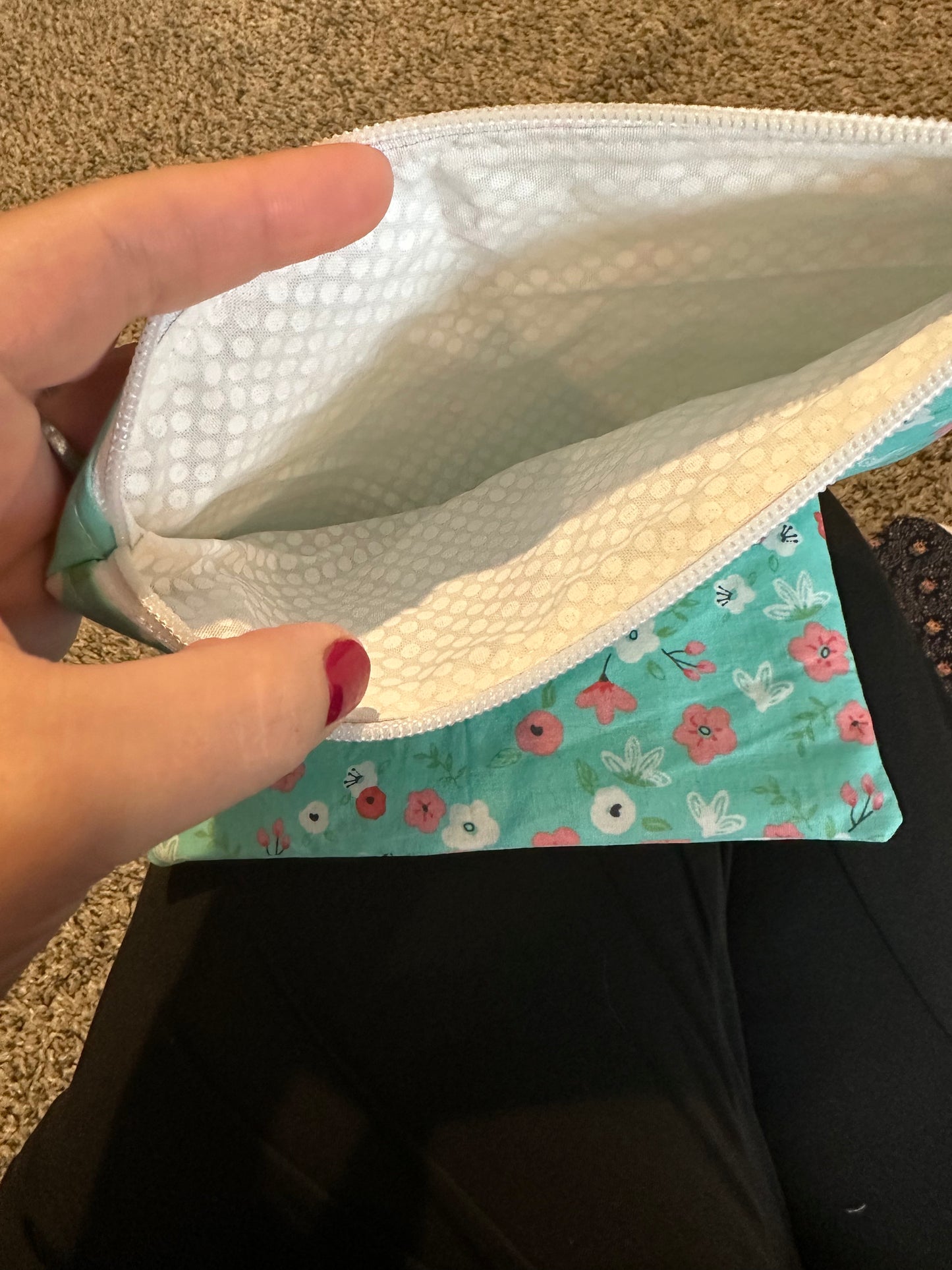 Pinched zipper flap pouch